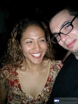 Happy couple and friend at wedding party