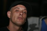 Black-Clothed Man with Baseball Cap