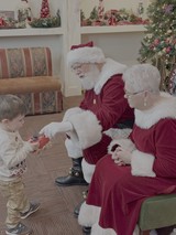 Santa and Mrs. Claus Visit Young Child