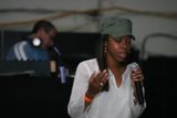 Green Hat Woman with Microphone