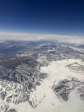 Soaring Over Snowy Peaks