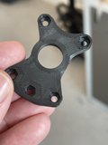 Mysterious plastic piece found among rusty machinery