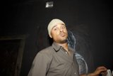 Man in Cap Admiring Artwork