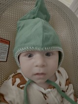 Baby in Green Elf Hat Hospital Portrait