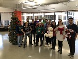 Office Team Celebrates Christmas in Ugly Sweaters
