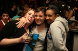 Three Friends Goofing Around at a Napster Party