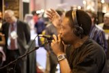 Musician Performing with Headphones and Microphone