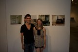 Posing in Front of Art Display