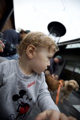 Young Child in Mickey Mouse Sweatshirt on Boat