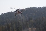 A Helicopter Fighting Flames from Above