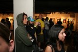 A Crowd of Hat-Wearing Art Lovers