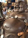 Serene Buddha in a Boozy Setting