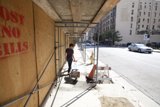Construction Worker at Plywood Site