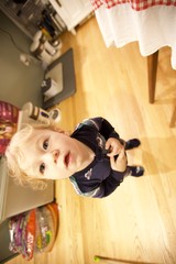 Curious Toddler in Kitchen on Christmas Morning