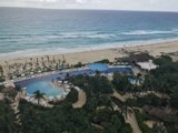 Aerial View of Luxurious Resort Pool and Beach