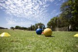 A Game of Bocce under the Blue Sky