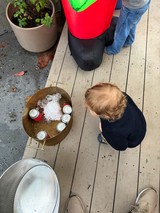 Child Observing Ice-Cold Drinks at Outdoor Gathering