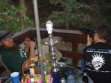 Green Shirted Man Enjoying a Hookah