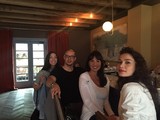 Four Friends Gathered in a Rustic Restaurant Interior