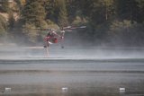 Aerial View of a Helicopter over a Water Body