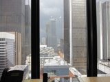 Cityscape view from a high-rise apartment window
