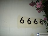 Black numbers on white wall