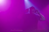 Solo Performance Under Purple Lights