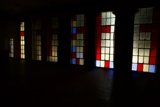 Colorful Stained Glass Windows In a Dark Room