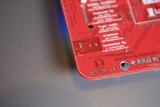 Inside the Machine: A Close-Up of a Red Circuit Board