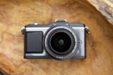 A Close-up of a Camera on Wooden Surface