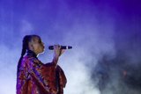 FKA twigs Beautiful Upper Body Profile Singing Baby Hairs Swirls Hoop Earrings Braided Ponytail Black Choker Rings Kimono Red Brocade Gold Purple Patterns Purple Blue Lighting Heavy White Haze