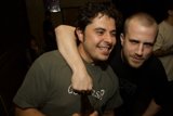 Green-shirted man enjoying a night out with friends