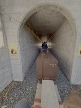 Miniature Train Journey Through Stone Tunnel