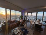 Cityscape View from Penthouse Living Room