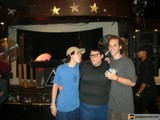 Three Fans Enjoying Live Music