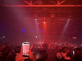 Electric Red Concert Atmosphere with Massive Crowd
