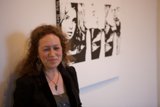 Woman Contemplates Black and White Masterpiece