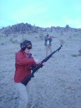 Two Shooters at Desert Outdoor Range at Dusk