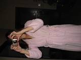 Woman in Pink Robe Taking Mirror Selfie with Canon