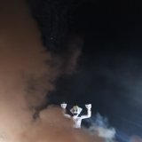 Arms Raised in a Dark Night Sky