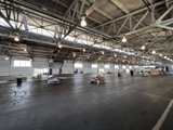 Illuminated Boxes in an Empty Warehouse
