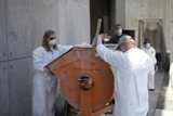 White-suited Workers at the JPL Mars Rover Factory