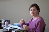 Woman Studying with Highlighter at Desk