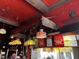 Red Ceiling and Signs at Popular Restaurant