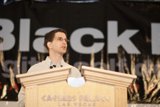 Jeff M Speaking at a Podium