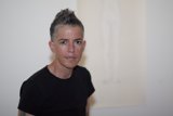 Portrait of a Happy Woman in a Black T-Shirt