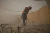 Hard at Work on the Concrete Floor