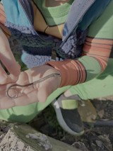 Rescue Worker's Hand Reaching for Safety Equipment