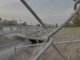 View Through Chain Link Fence of Industrial Site