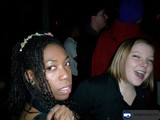 Two Women Strike a Pose at a Party